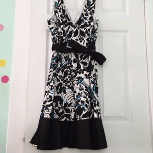 Jones wear black, white, turquoise dress